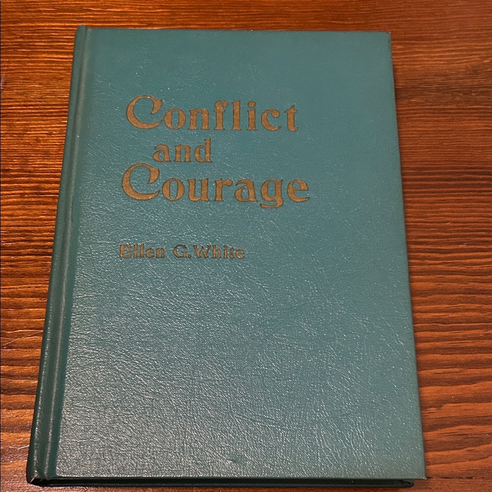 Teal Hardcover Book 'Conflict and Courage'